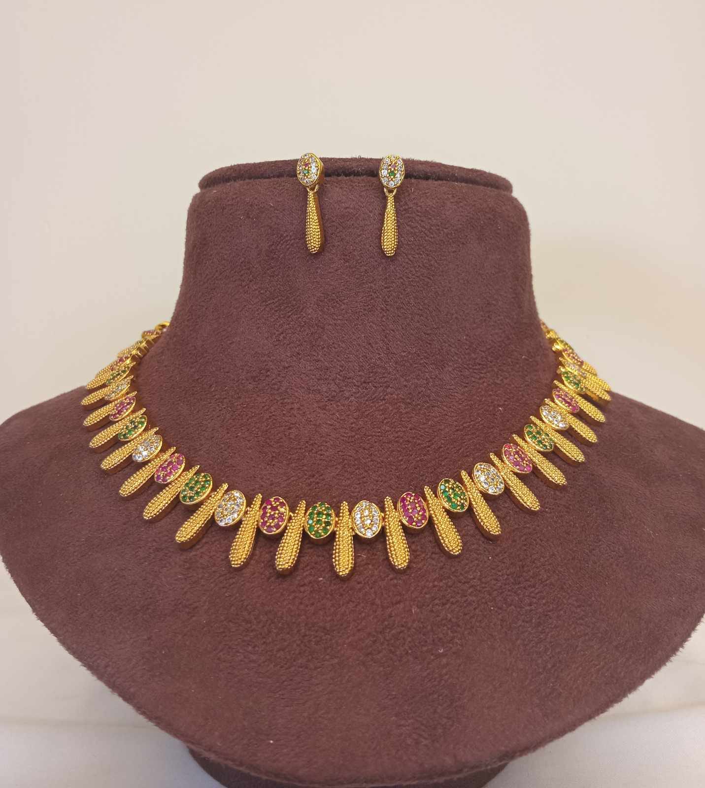 gold-finish-ad-stone-forming-jewelry