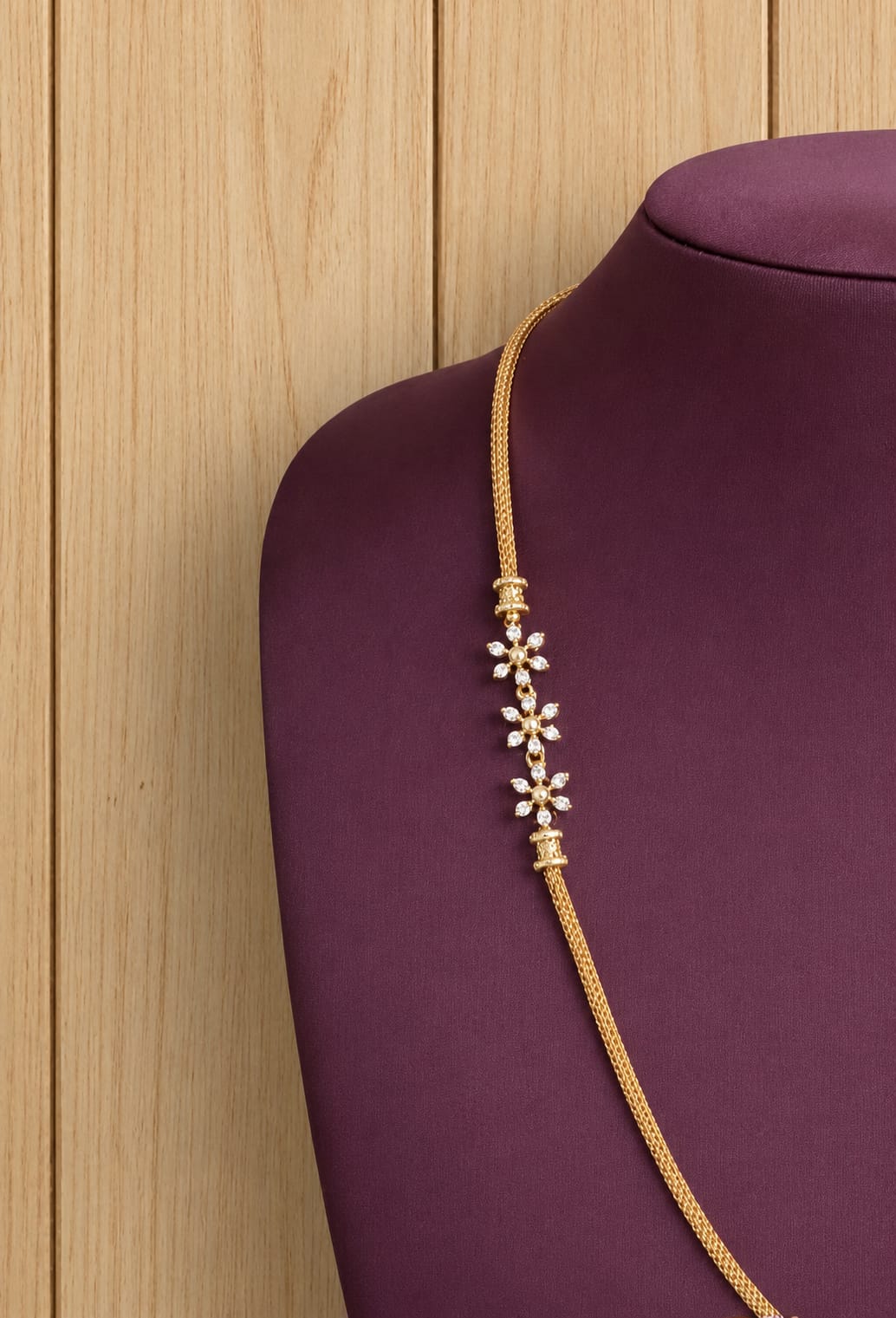 gold-finish-ad-stone-floral-mugappu-chain