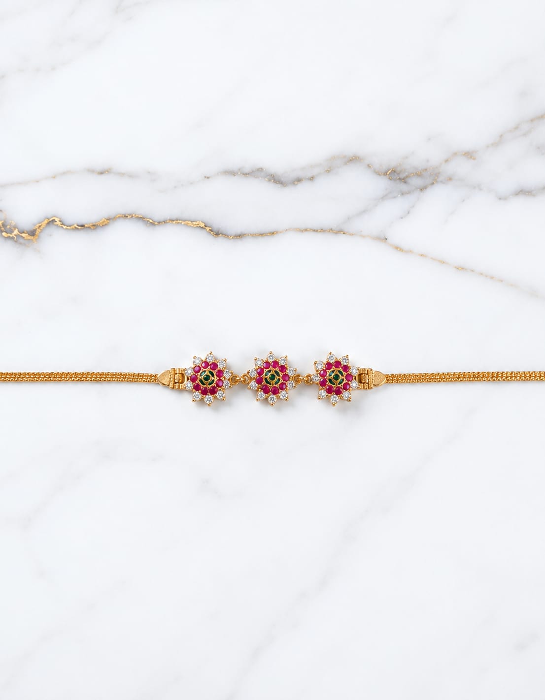 gold-finish-ad-stone-floral-mugappu-chain