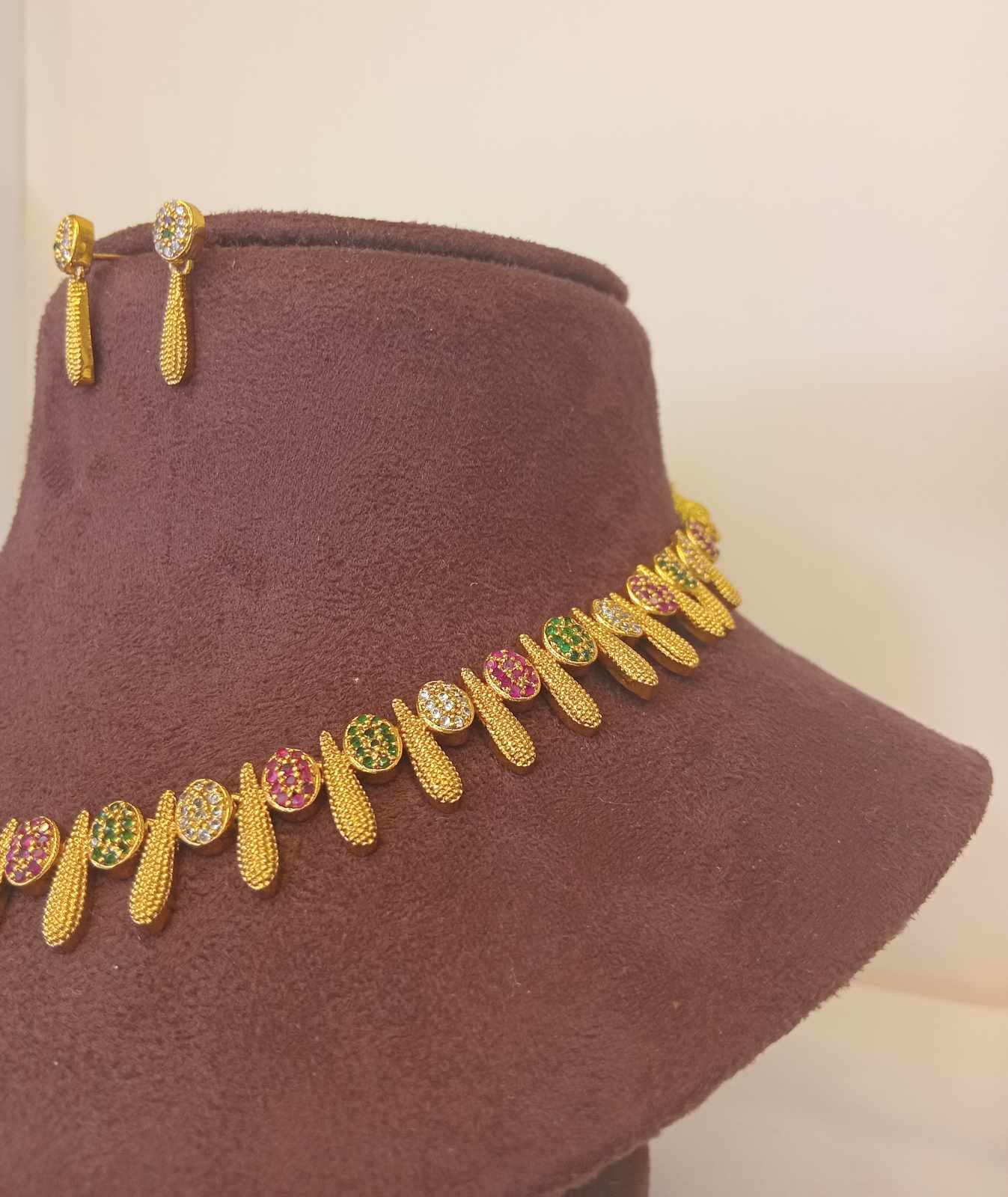 gold-finish-ad-stone-forming-jewelry